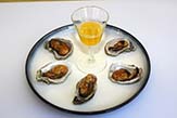 Smoked oysters with clarified lemon butter.