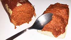Sobrasada is a soft spreadable sausage which is served on a roll, very often with honey or apricot marmalade.